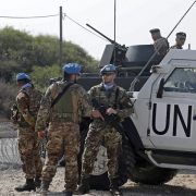 (L to R) Lebanese army soldiers and peacekeepers of the United Nations Interim Force In Lebanon (UNIFIL) are stationed in Lebanon's southern Naqoura along the border with northern Israel's Rosh HaNikra on October 27, 2022. - Lebanon and Israel are expected to sign their maritime deal today, following lengthy negotiations mediated by Washington. (Photo by MAHMOUD ZAYYAT / AFP)